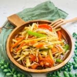 Ginisang toge: a Filipino stir-fry dish featuring crunchy bean sprouts, carrots, bell peppers and sweet potatoes, sautéed with garlic, onions, tomatoes, and seasoned with soy sauce and fish sauce, served steaming hot.
