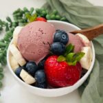 Acai bowl topped with fresh fruits made using Ninja Creami.