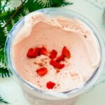 Freshly churned Ninja Creami strawberry ice cream ready to scoop.
