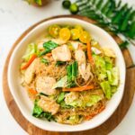 Pancit with Chicken with assorted toppings on a plate.