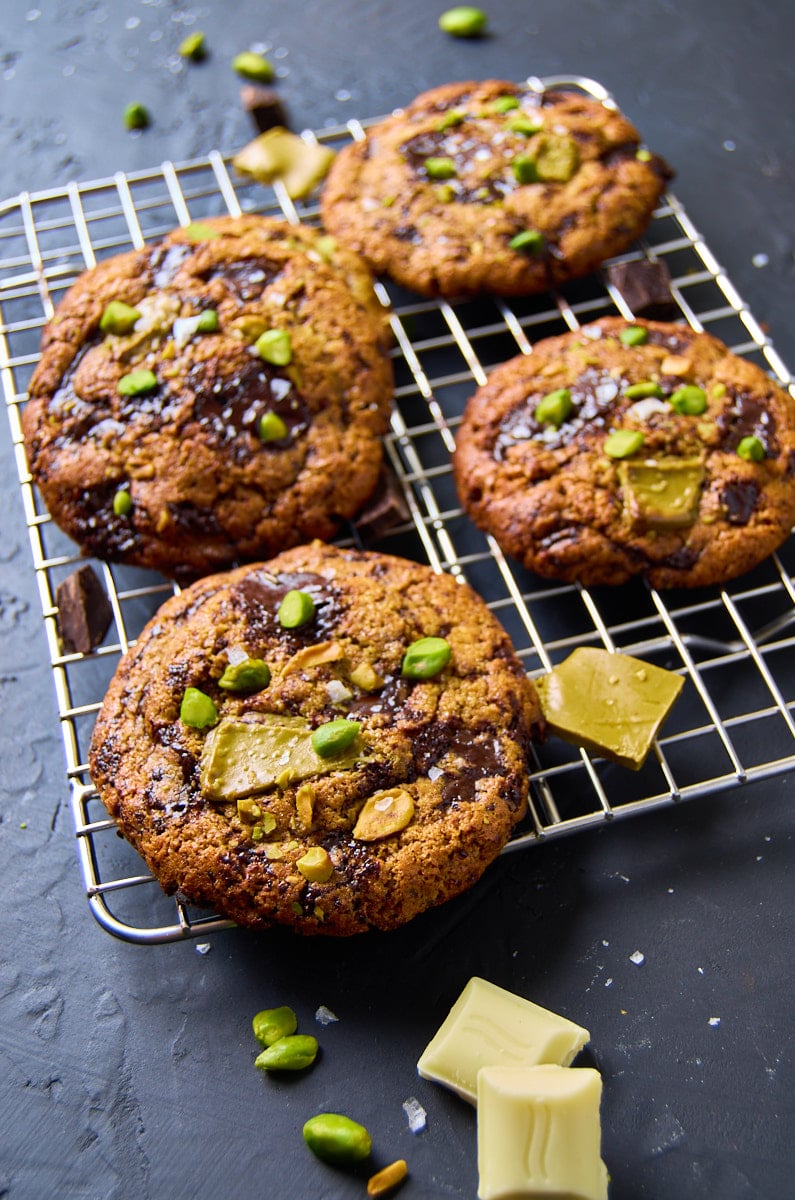 High-protein pistachio cream chocolate chip cookies with brown butter, melty chocolate chunks, and creamy pistachio filling, inspired by Dubai desserts.