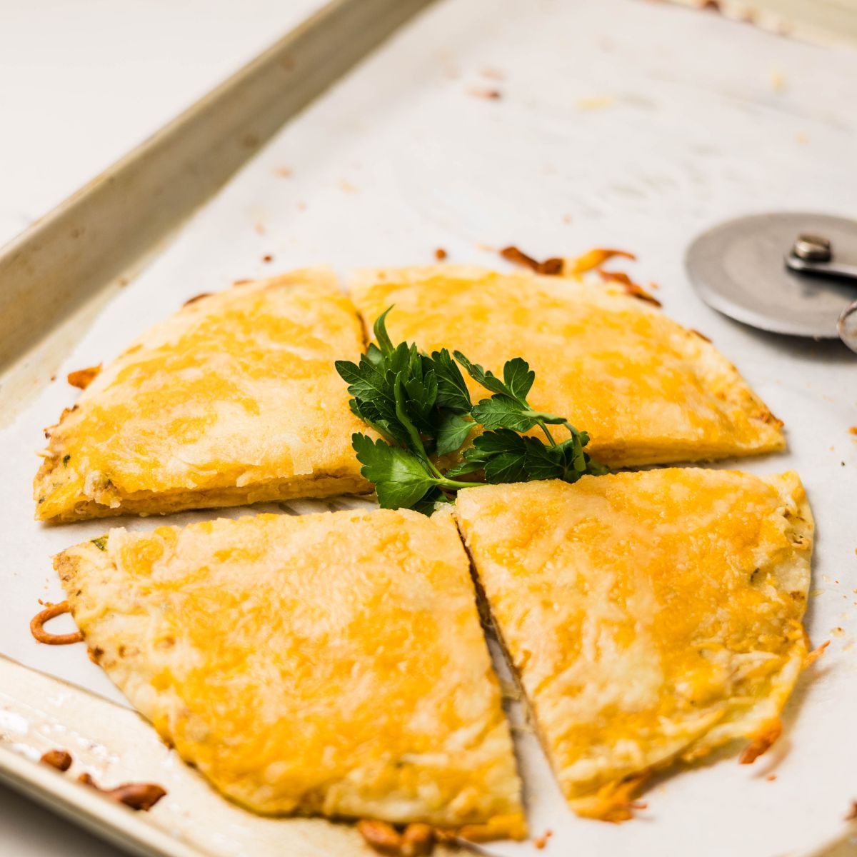 Sliced cheesy tortilla garlic bread.