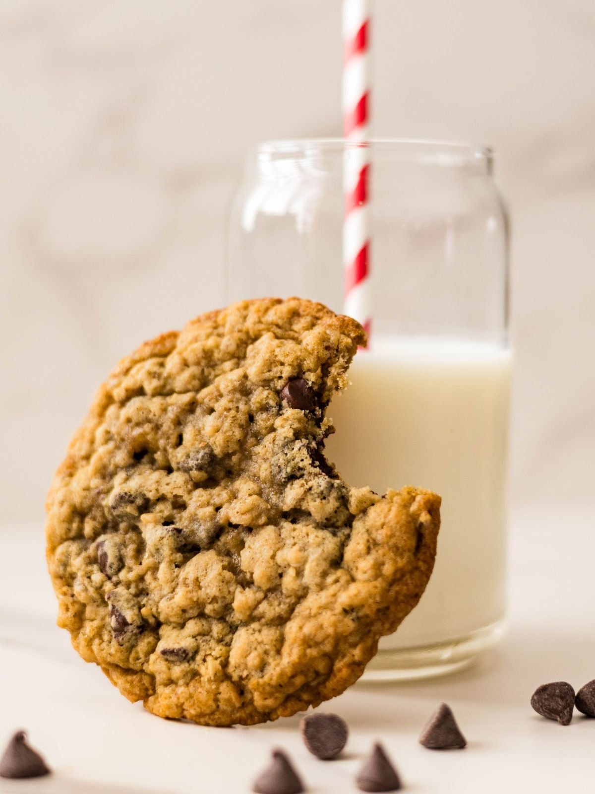 Brown butter oatmeal chocolate chip cookies with melted chocolate and golden edges.