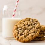 Brown butter oatmeal chocolate chip cookies with melted chocolate and golden edges.