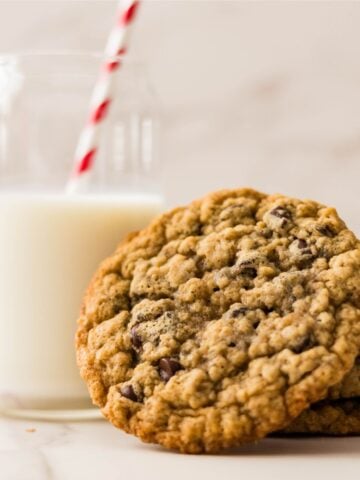 Brown butter oatmeal chocolate chip cookies with melted chocolate and golden edges.