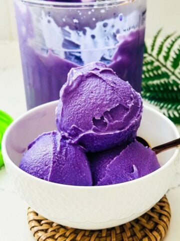 Three scoops of ube ice cream made using Ninja Creami.