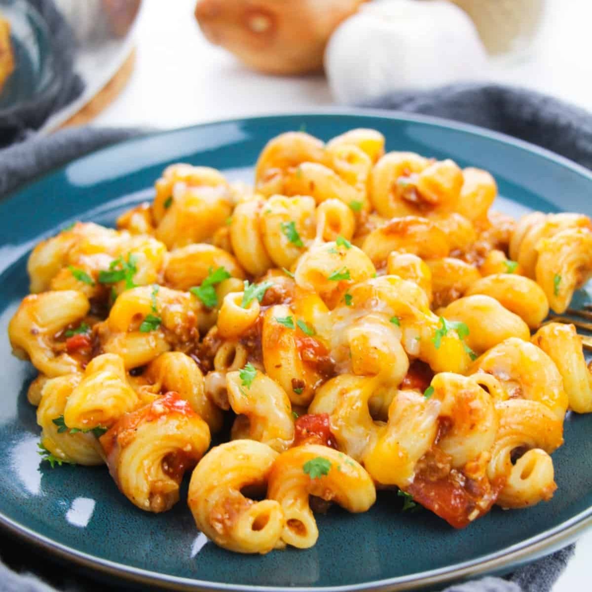 Cheesy Beef Enchilada Pasta in skillet โ easy Tex-Mex-inspired weeknight dinner.