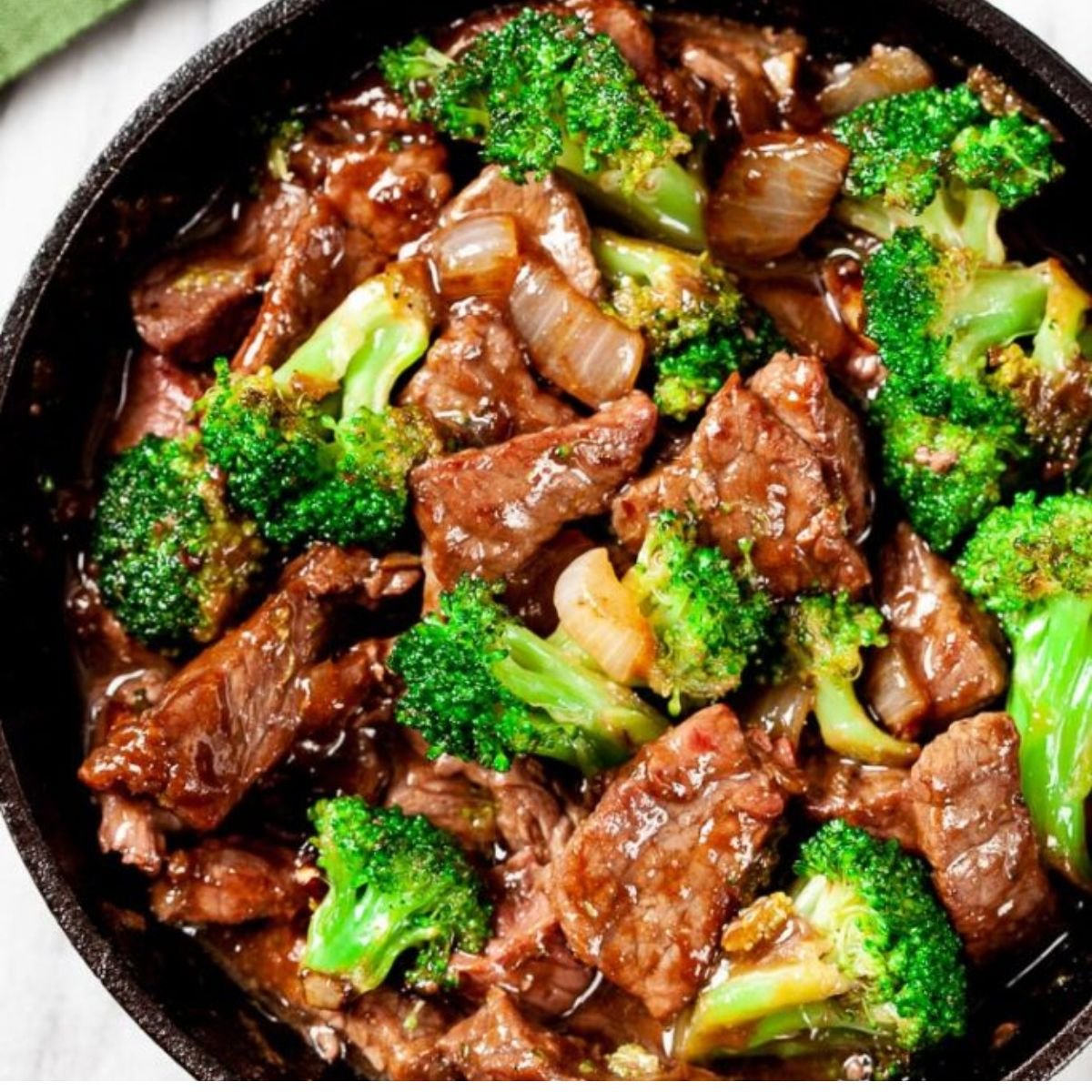 Homemade Beef and Broccoli Stir Fry coated in garlic soy sauce โ easy takeout-style beef recipe.
