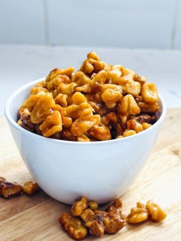 Crispy candied maple walnuts with shiny caramelized coating ready to store in airtight jar.