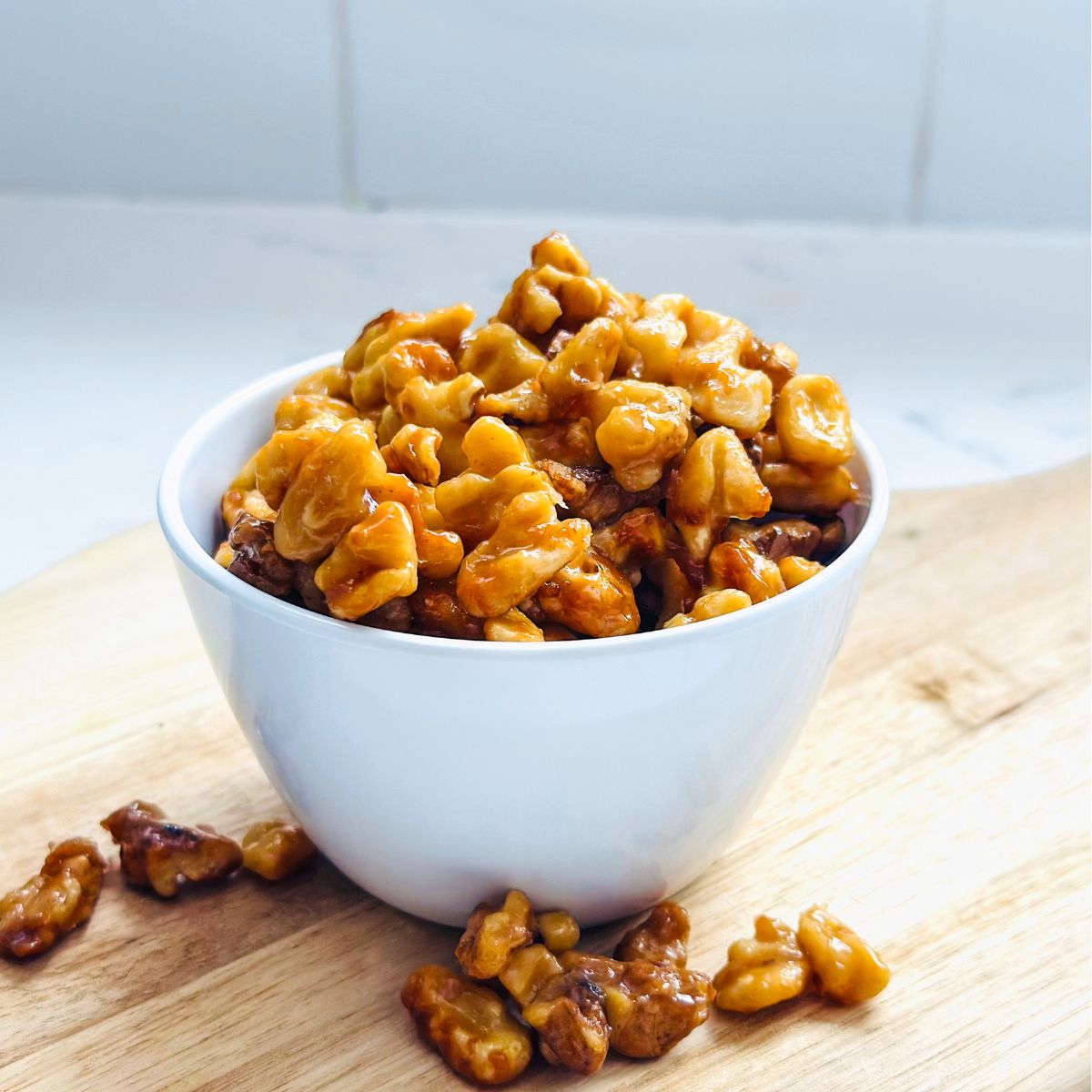 Crispy candied maple walnuts with shiny caramelized coating ready to store in airtight jar.