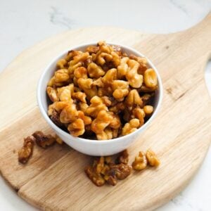 Crispy candied maple walnuts with shiny caramelized coating ready to store in airtight jar.