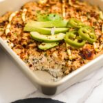 Pan of spicy tuna sushi bake made with rice, furikake, and baked tuna mixture, ready to serve.