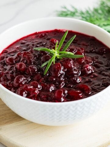 Fresh cranberry sauce without sugar cooling in a bowl for Thanksgiving.