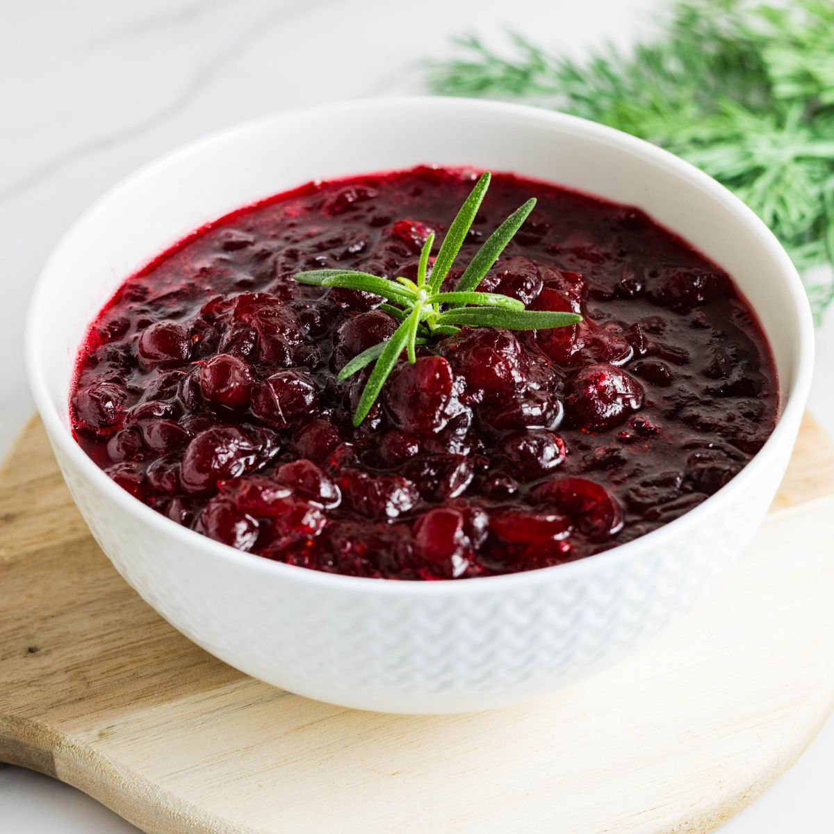 Fresh cranberry sauce without sugar cooling in a bowl for Thanksgiving.