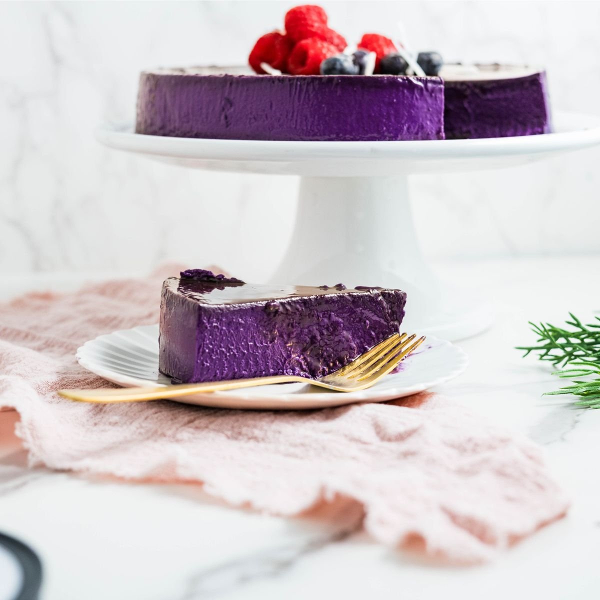 Slice of ube leche flan on a plate, showing its vibrant purple color and creamy, silky custard texture.