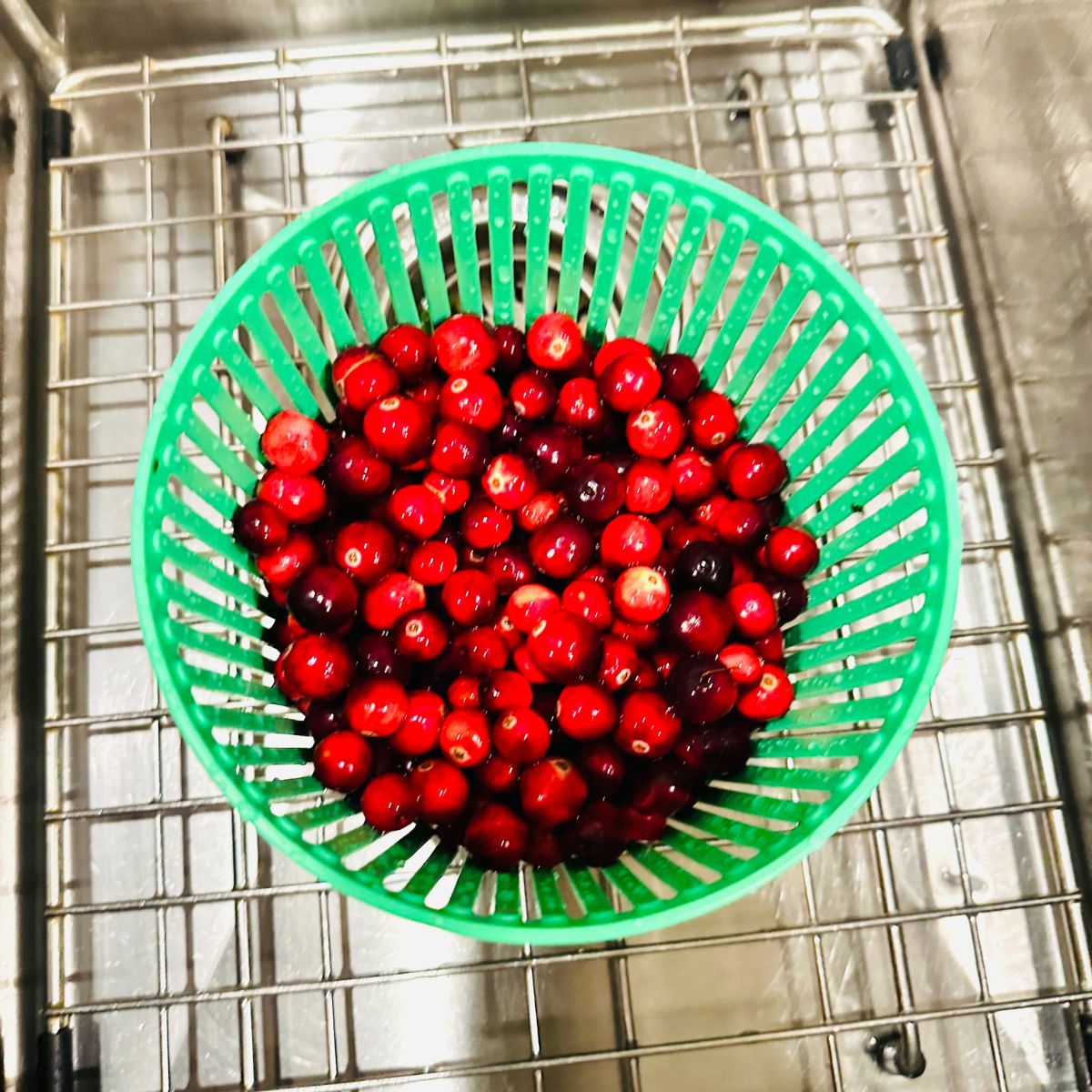 Washing fresh cranberries.