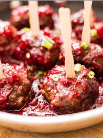 Easy cranberry sauce meatballs on a skillet.