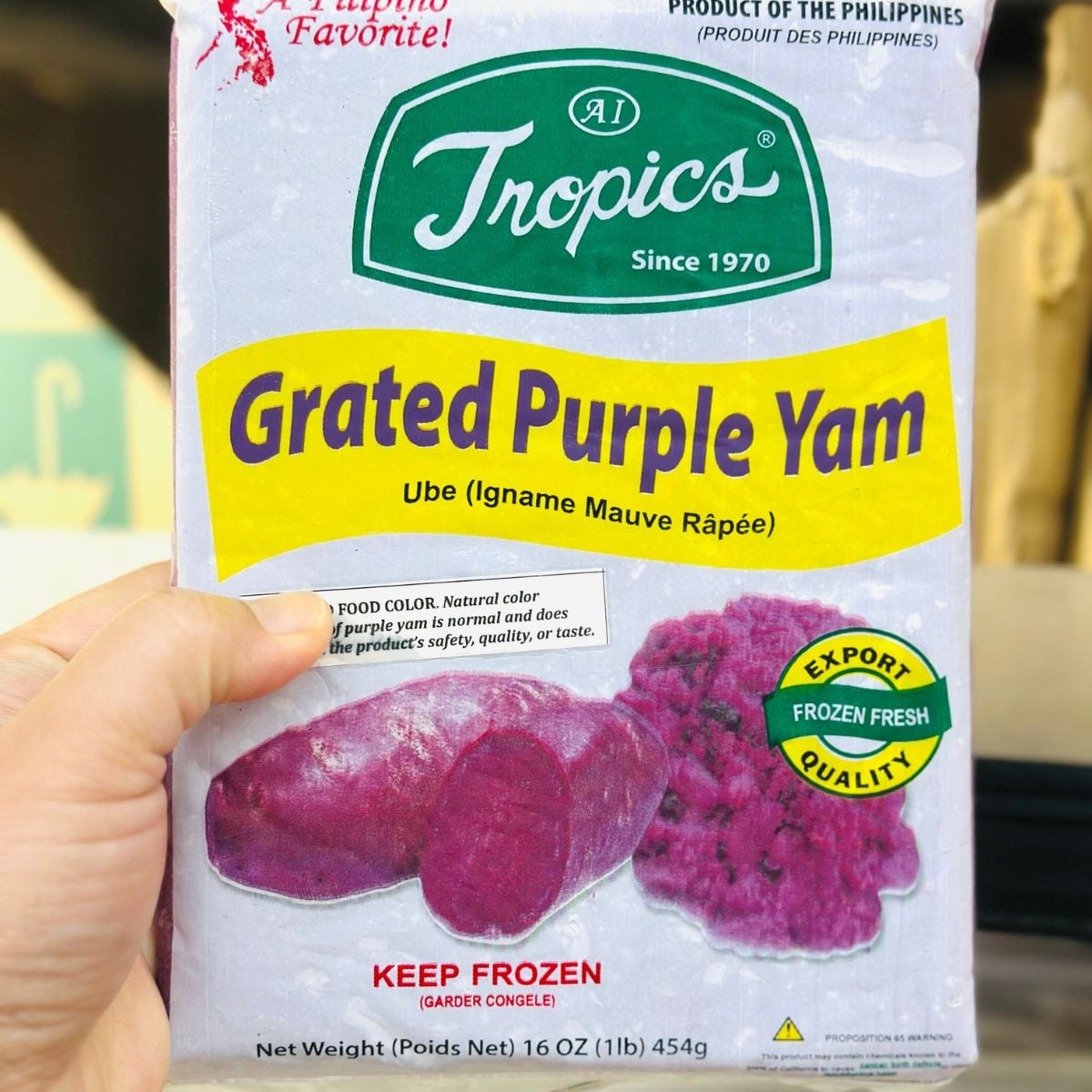 Packaged frozen grated purple yam ube from the Philippines held by hand.