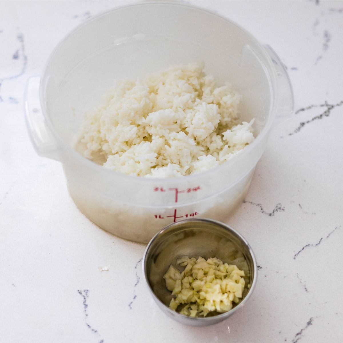 Day-old white rice and chopped garlic ready to make Filipino garlic fried rice sinangag.