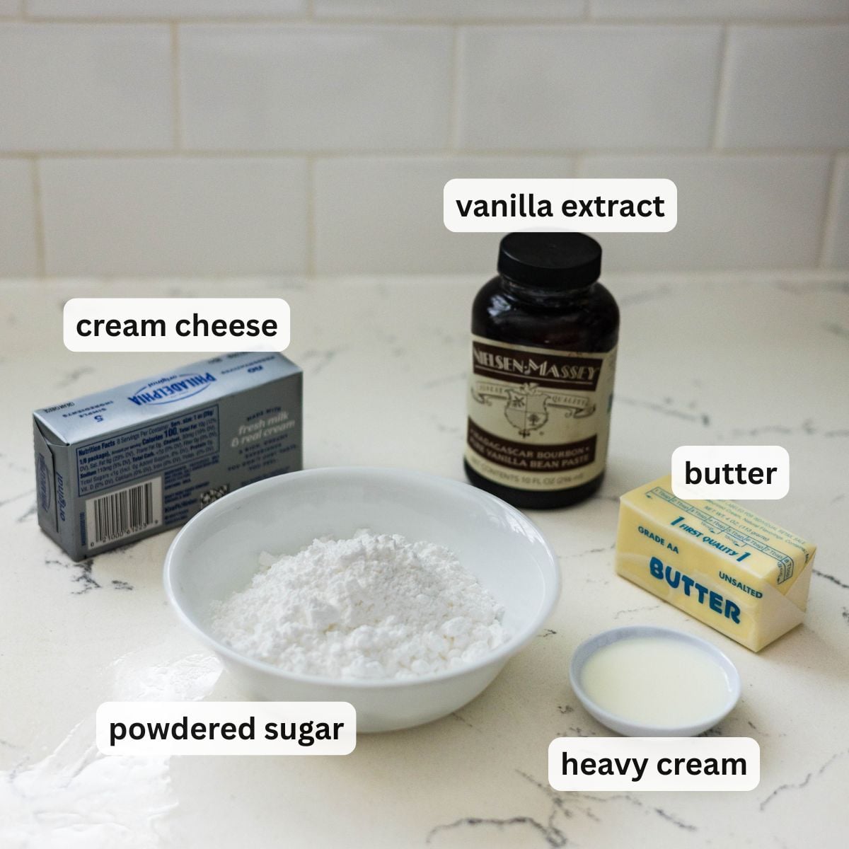Cream cheese frosting ingredients for Filipino ensaymada including cream cheese, butter, powdered sugar vanilla, and heavy cream