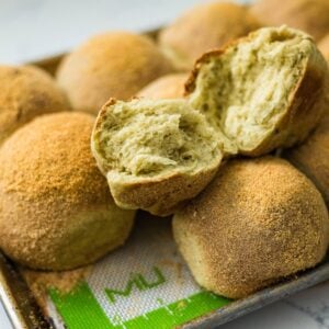 Close-up of torn malunggay pandesal showing the soft fluffy inside.