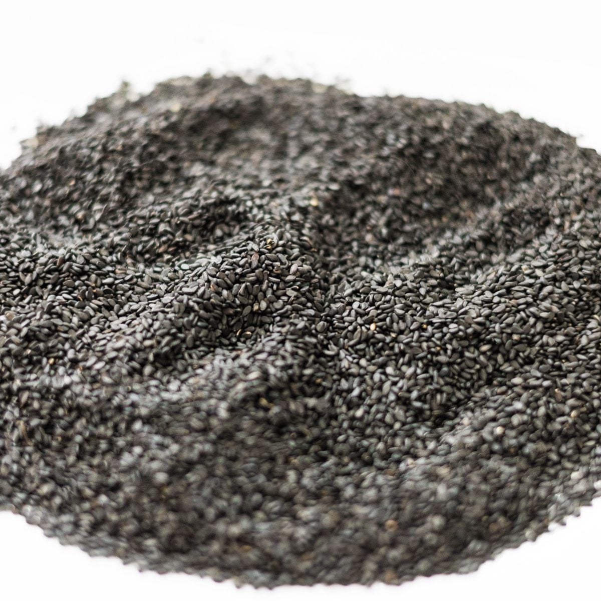 Cooling toasted black sesame on a plate