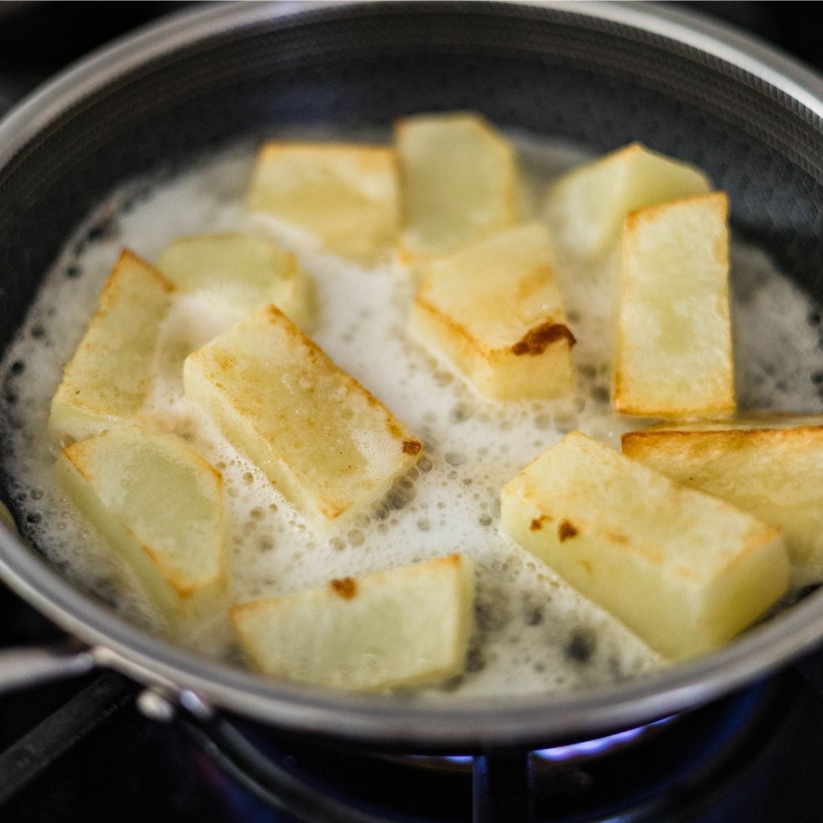 ukon Gold potato chunks frying in oil for Japanese beef curry.