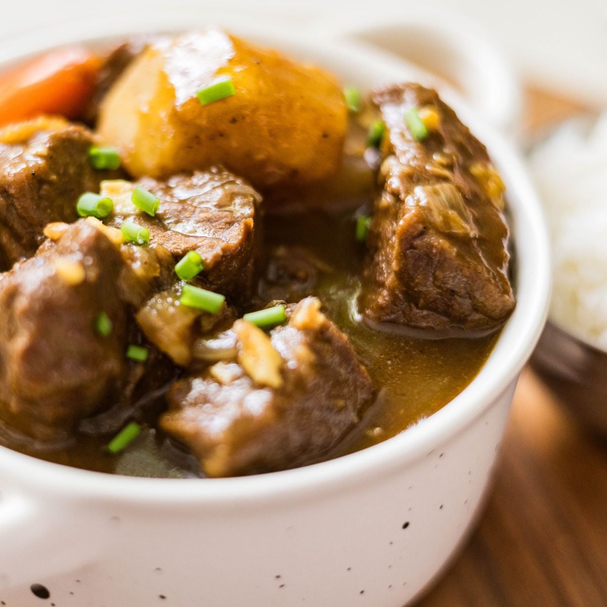 Japanese beef curry with tender beef, potatoes, and carrots served with rice.