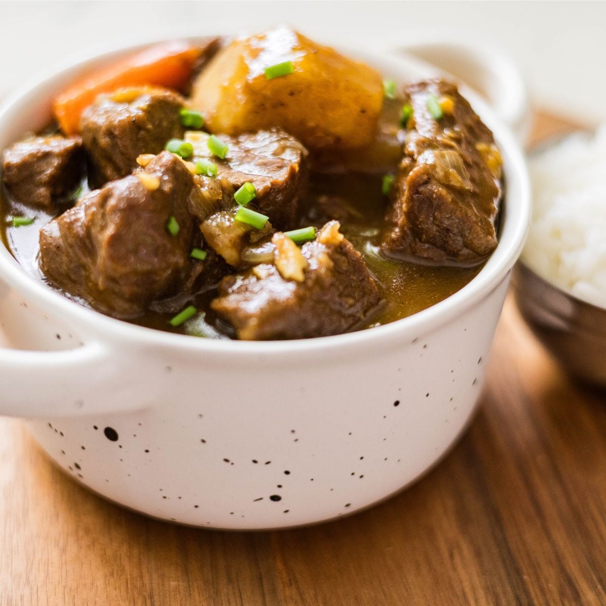 Japanese beef curry with tender beef, potatoes, and carrots served with rice.