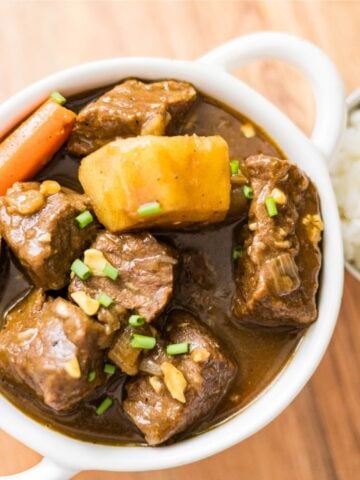 Japanese beef curry with tender beef, potatoes, and carrots served with rice.