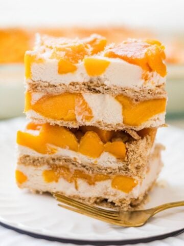 Creamy mango float slices layered with graham crackers and fresh mango