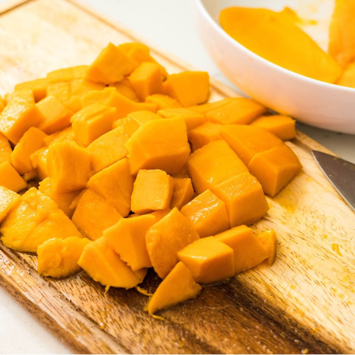Diced ripe mangoes prepared for homemade mango float