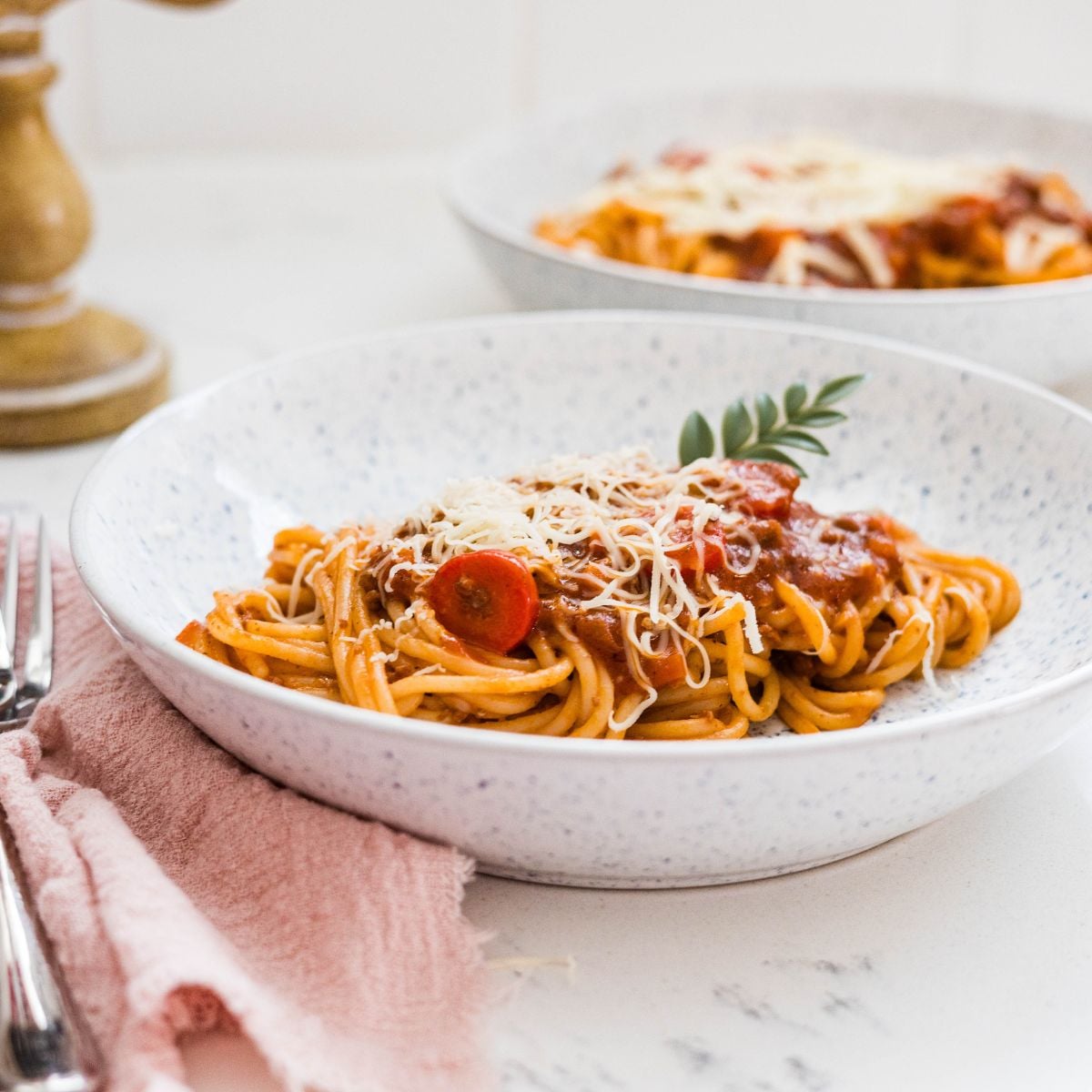 Easy Filipino spaghetti served with hotdogs, meat sauce, and cheese