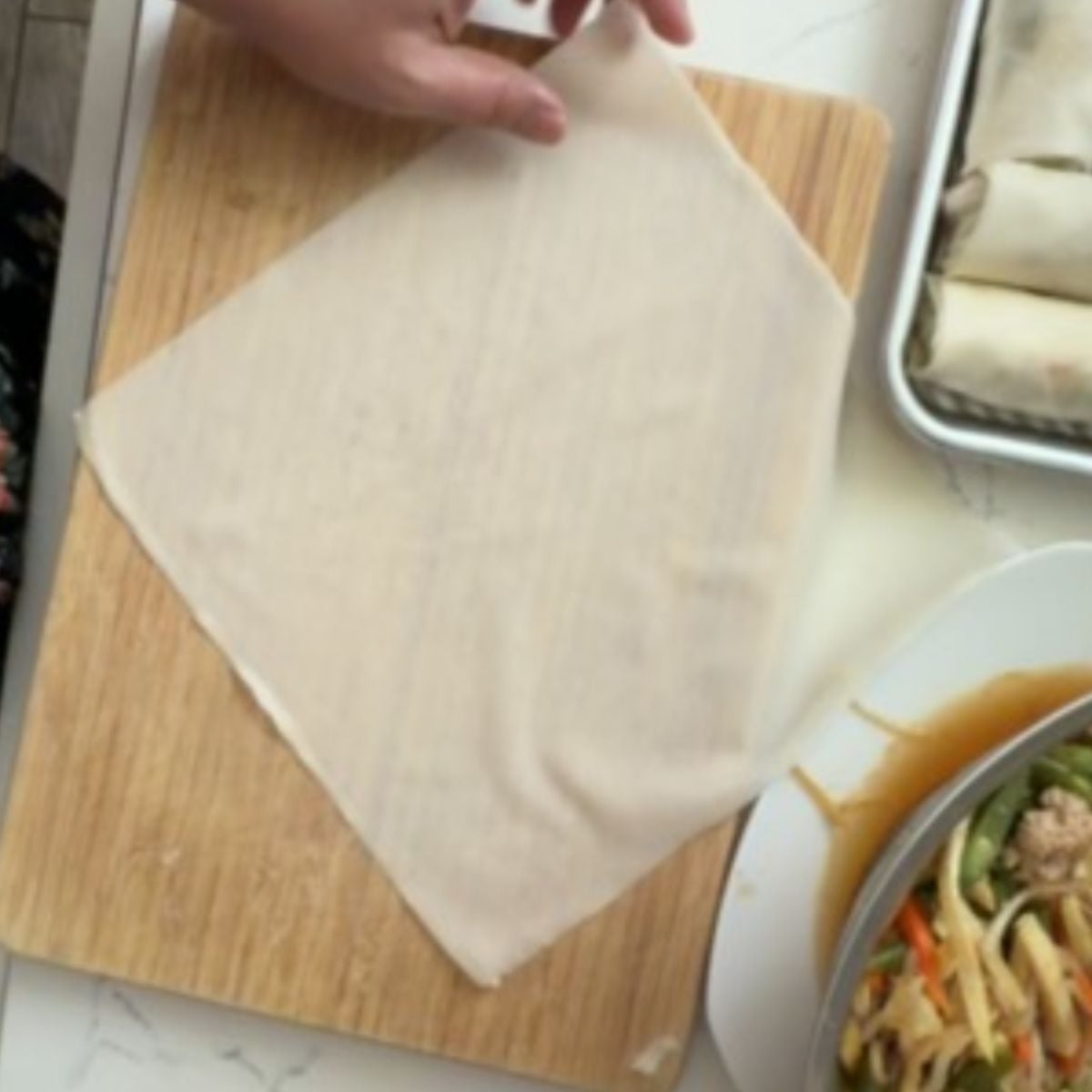 Setting up a lumpia wrapper for lumpiang gulay before adding the filling
