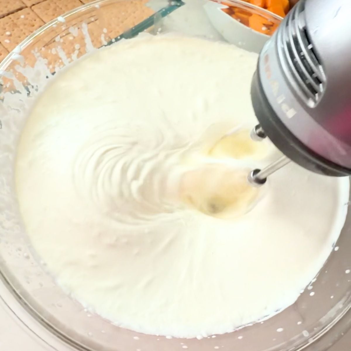 Whipping cream being mixed for Filipino mango float