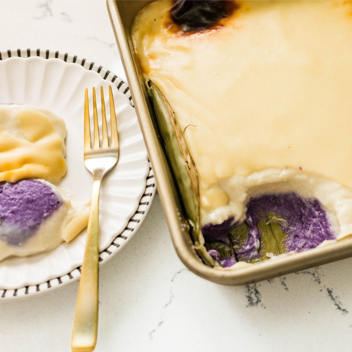 Filipino inutak dessert with purple ube and creamy coconut layers