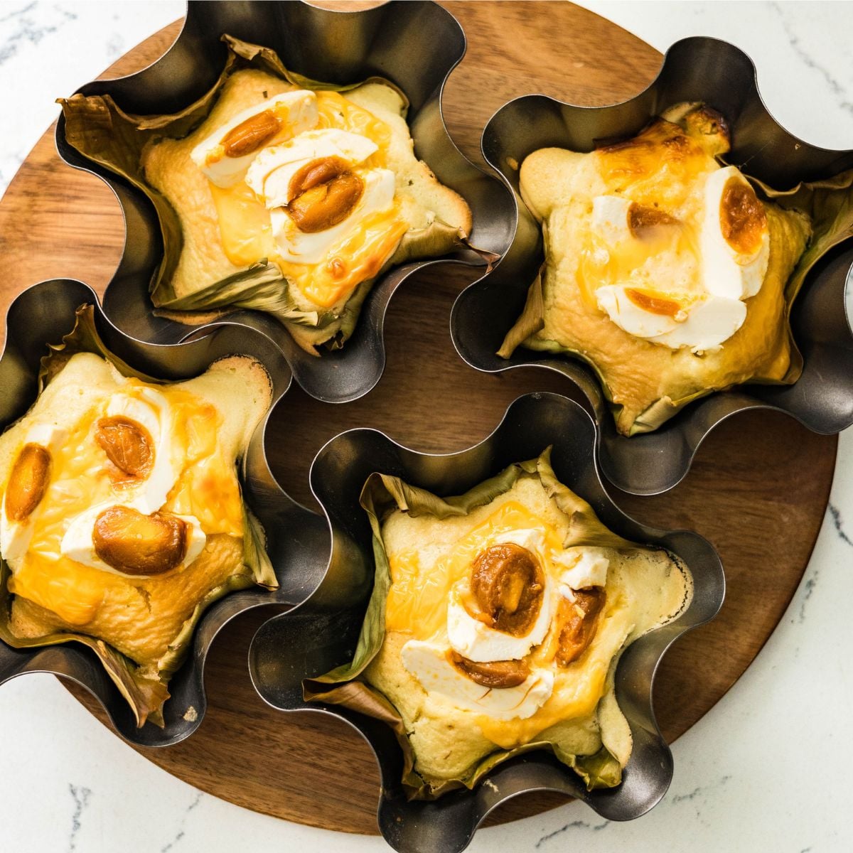 Homemade Filipino bibingka topped with salted egg and cheese