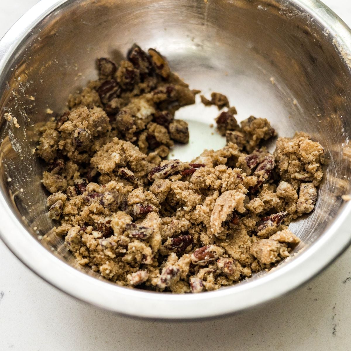 Mixing pecan streusel topping for purple sweet potato casserole