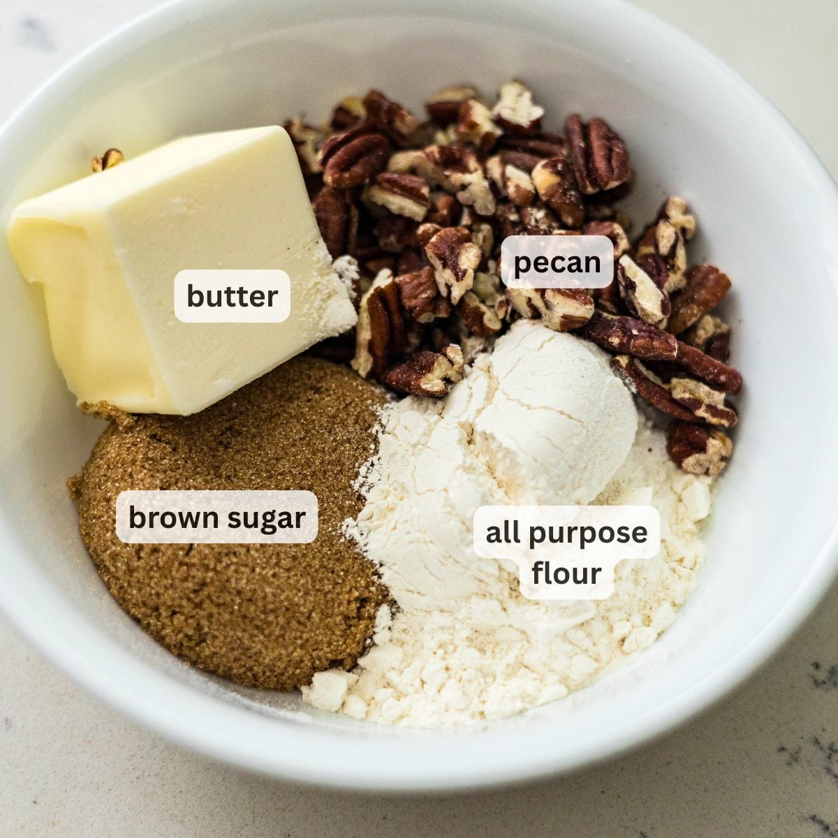 Ingredients for pecan streusel topping with butter, pecans, flour and brown sugar
