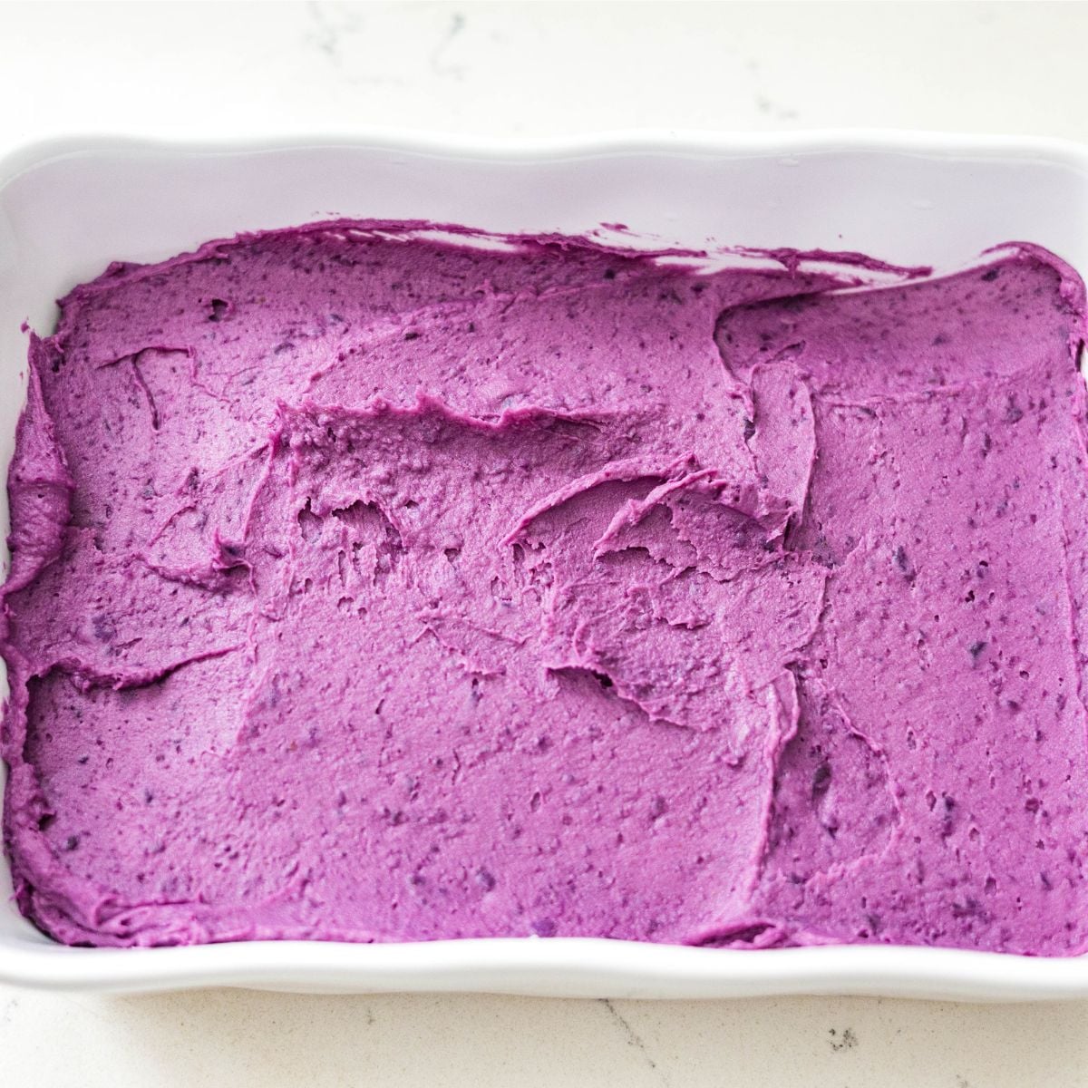 Purple sweet potato filling spread in a baking dish