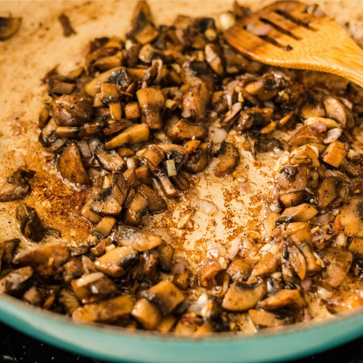 Sautéed mushrooms cooking together for carbonara