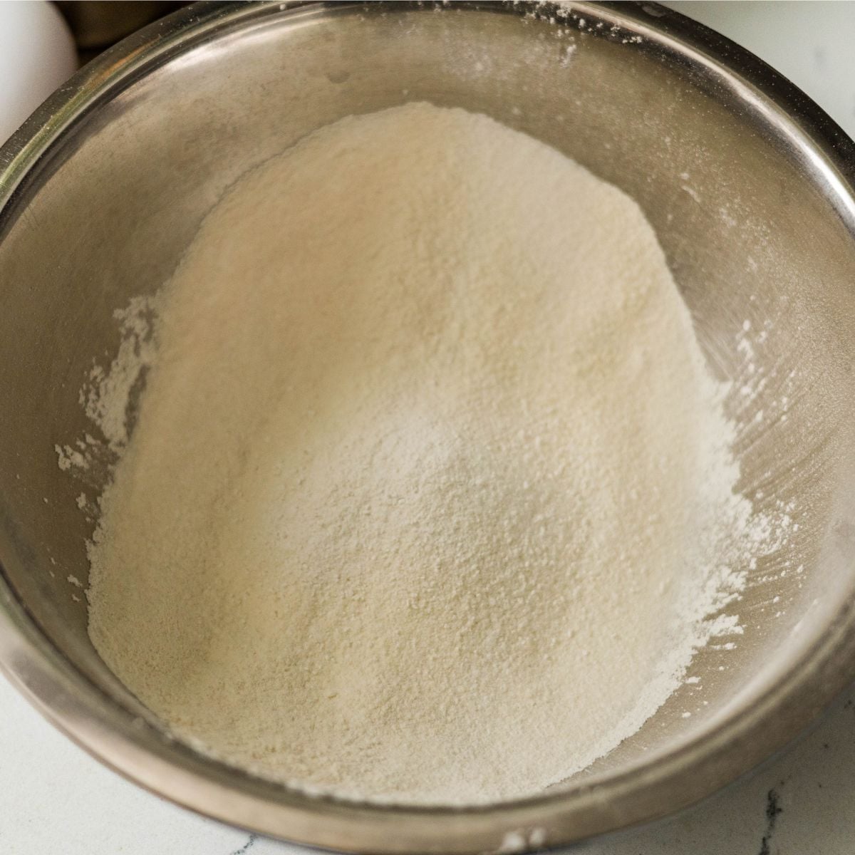 Sifted dry ingredients for homemade Filipino bibingka