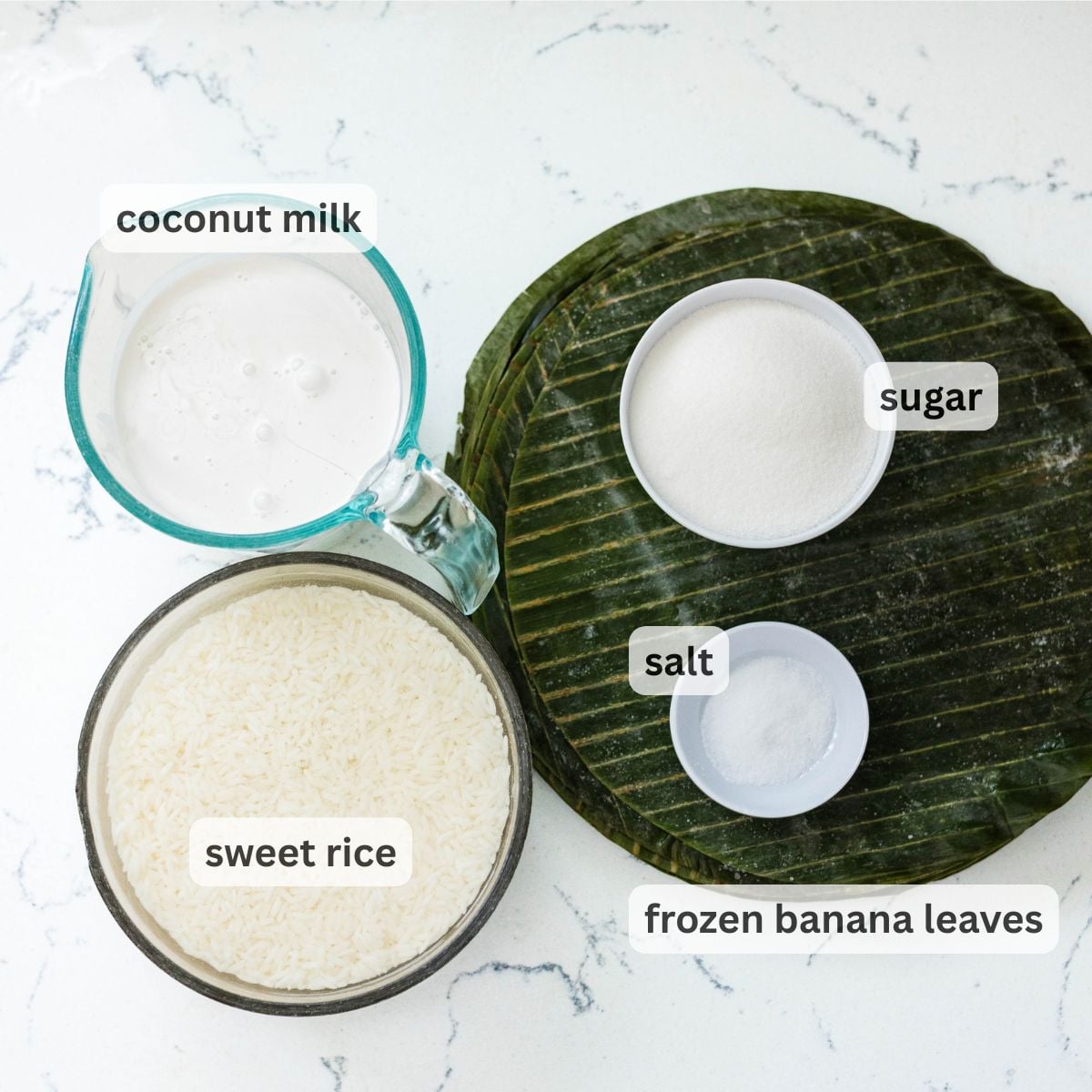 Ingredients for suman malagkit including sweet rice, coconut milk, sugar, salt, and banana leaves
