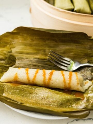 Suman malagkit served with sweet coconut caramel sauce